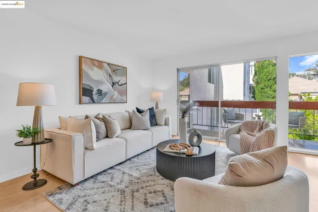 a living room with furniture and a lamp