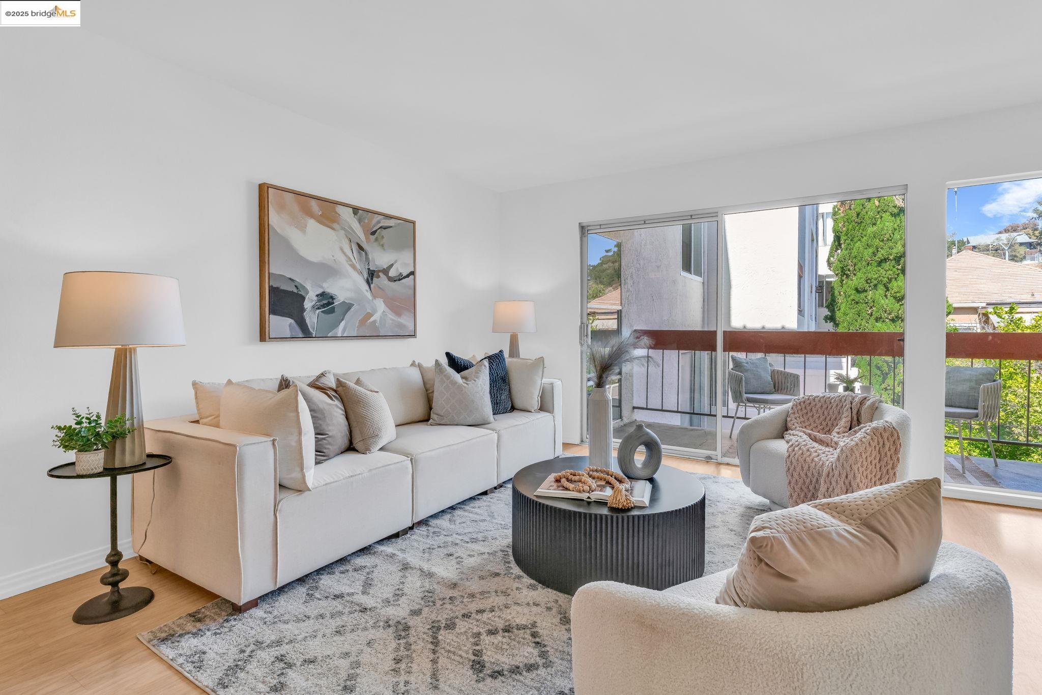 288 Whitmore Street, Unit 220 Oakland, CA 94611 - Photo 10 of 38 Living room with wood finished floors and baseboards