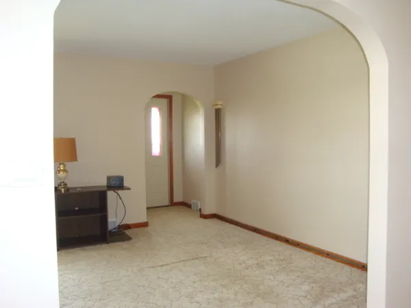 a view of an empty room and window
