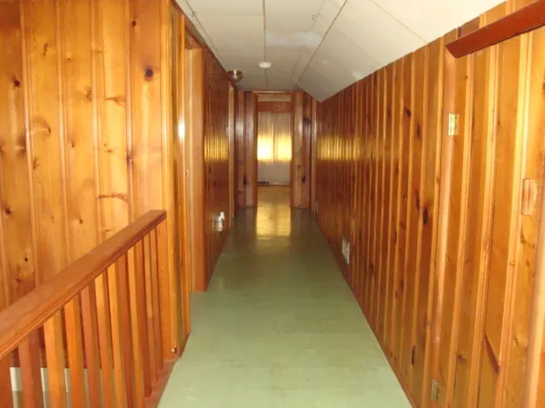 a view of a porch with wooden floor