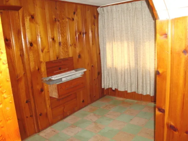 a view of a black door and a window