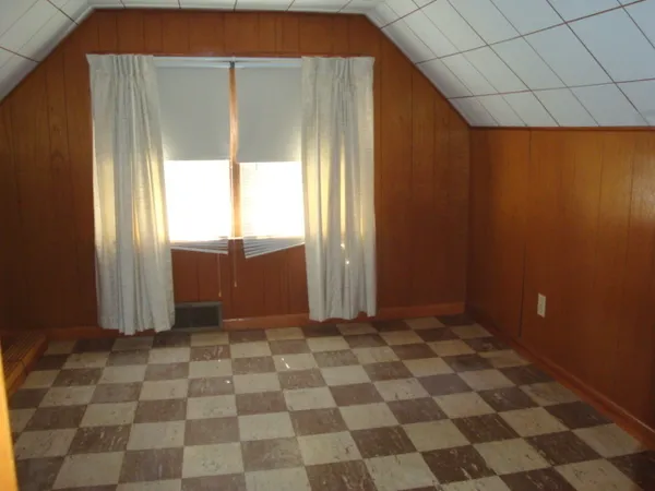 a bathroom with a sink a toilet and shower curtain