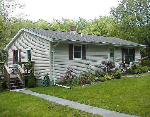 604 Guernseytown Road Watertown, CT 06795 - Photo 1 of 1 a view of a house with a yard plants and large tree