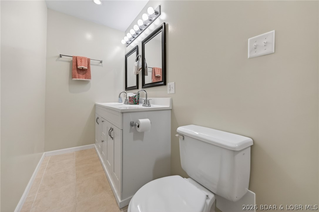177 Storage Road Eldon, MO 65026 - Photo 18 of 34 The durable ceramic floor tiling pairs seamlessly