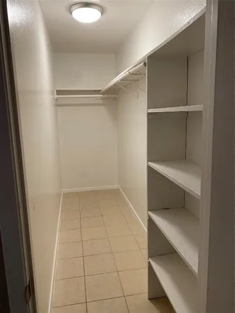 a view of an empty walk in closet