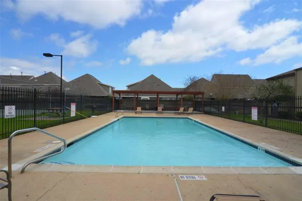 a view of swimming pool with a yard
