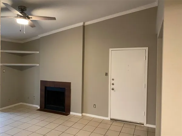 a room with a fireplace and a walk in closet