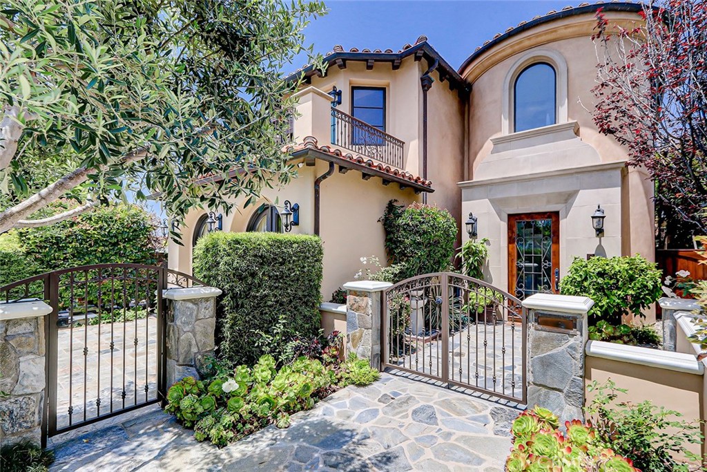 front view of a house with a garden