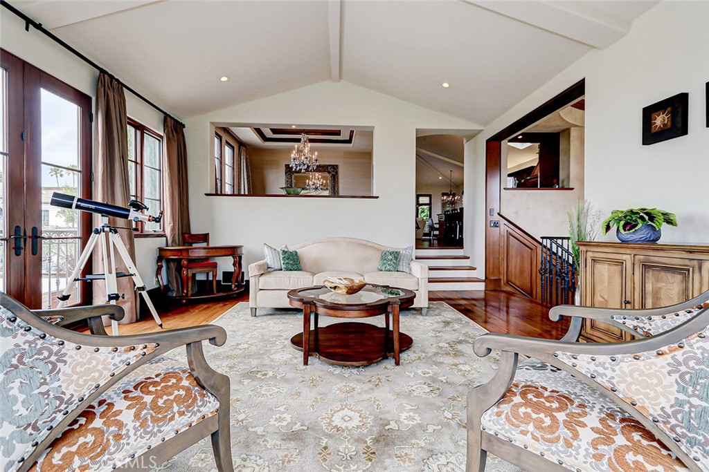 853 6th Street Manhattan Beach, CA 90266 - Photo 15 of 60 a living room with furniture stairs and a flat screen tv