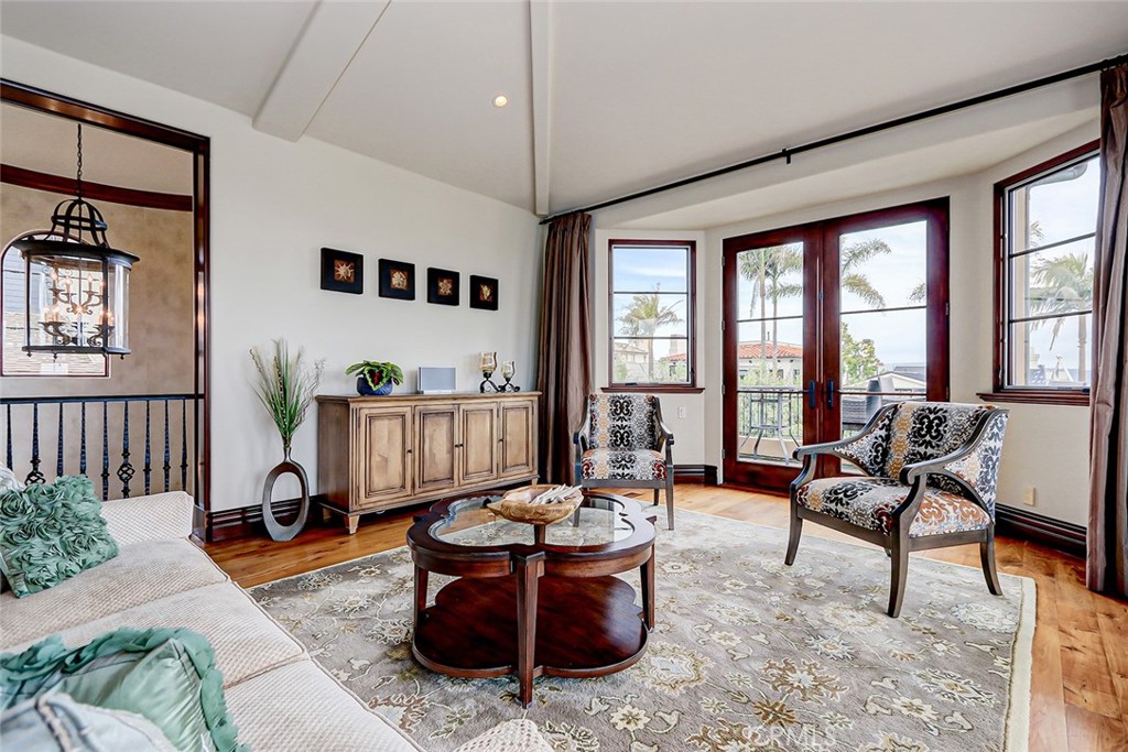 853 6th Street Manhattan Beach, CA 90266 - Photo 17 of 60 a living room with patio furniture and a large window