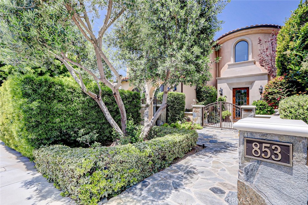 853 6th Street Manhattan Beach, CA 90266 - Photo 2 of 60 a front view of a house with a garden