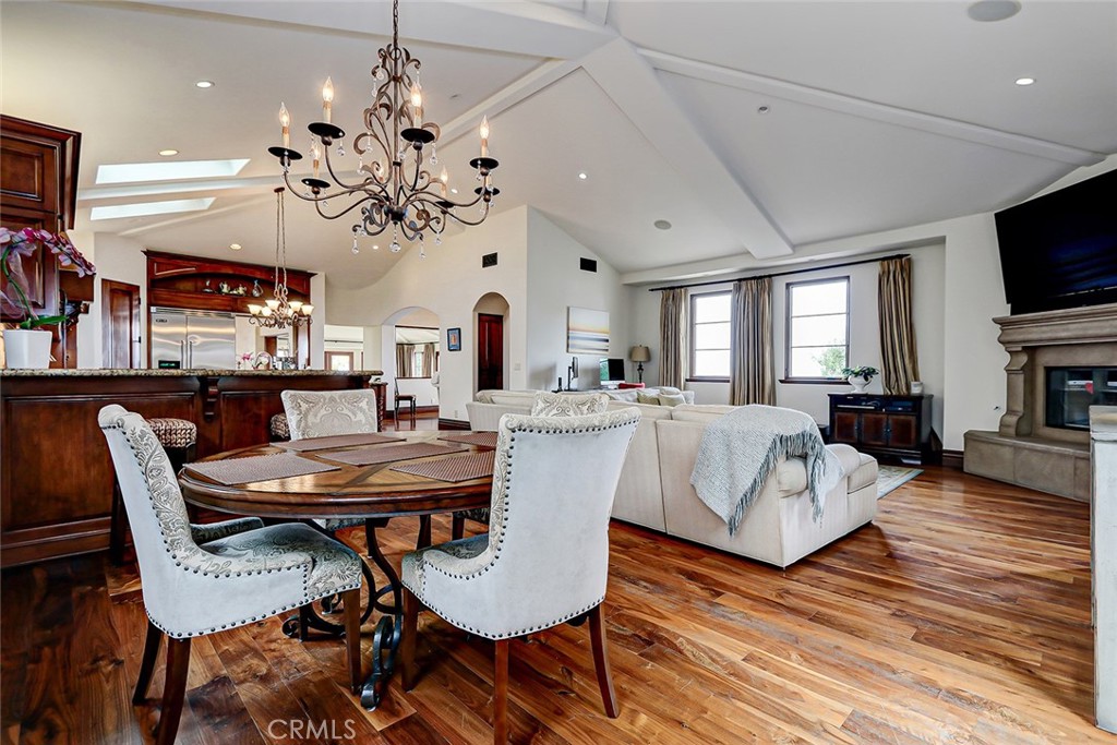 853 6th Street Manhattan Beach, CA 90266 - Photo 26 of 60 a view of a dining room with furniture a chandelier and wooden floor