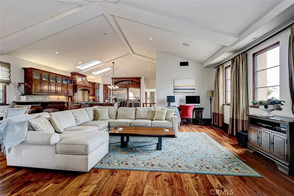 a kitchen with stainless steel appliances kitchen island granite countertop a stove and a cabinets