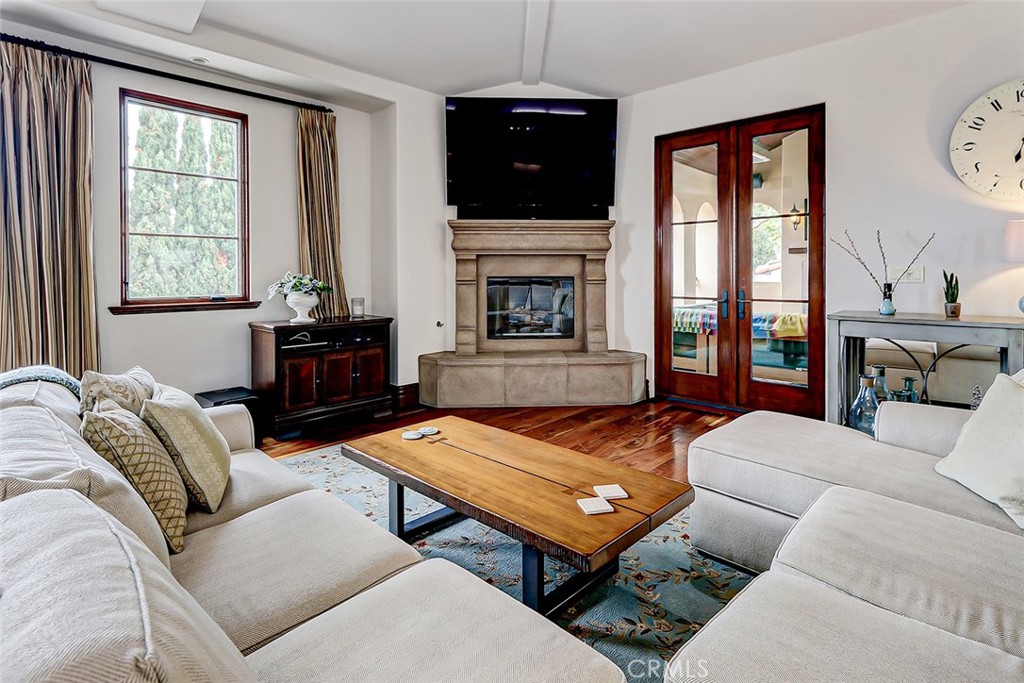 853 6th Street Manhattan Beach, CA 90266 - Photo 31 of 60 a living room with furniture and a fireplace