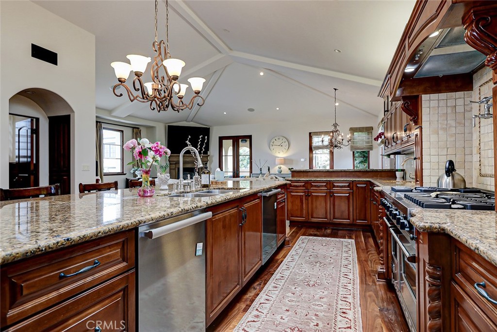 853 6th Street Manhattan Beach, CA 90266 - Photo 34 of 60 a large kitchen with stainless steel appliances granite countertop a stove and a view of living room