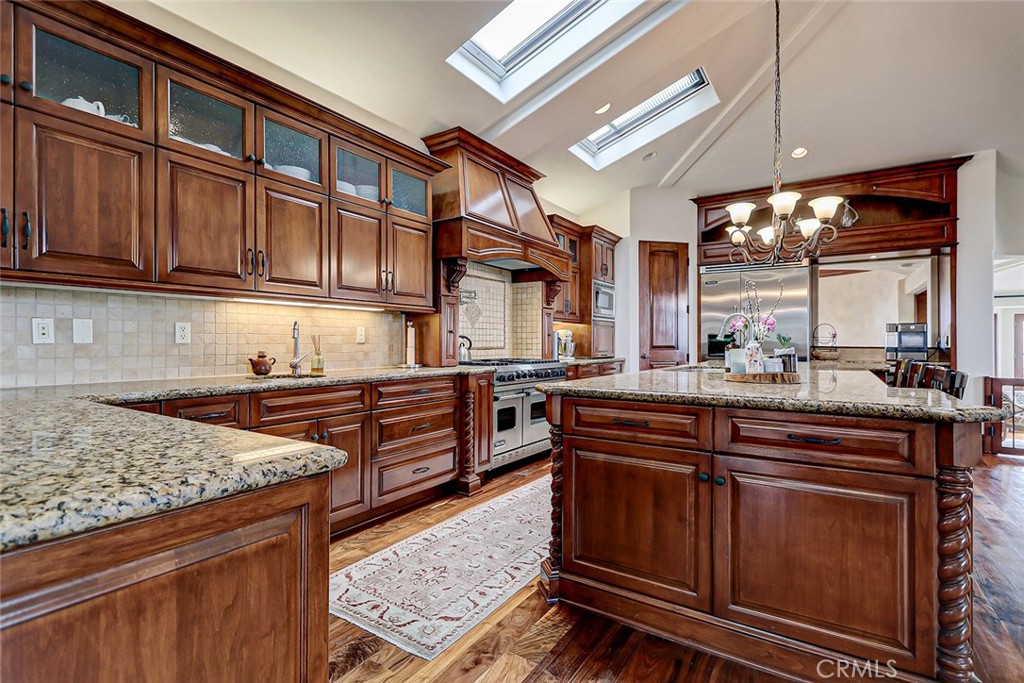 853 6th Street Manhattan Beach, CA 90266 - Photo 36 of 60 a kitchen with stainless steel appliances granite countertop a stove a sink and a microwave