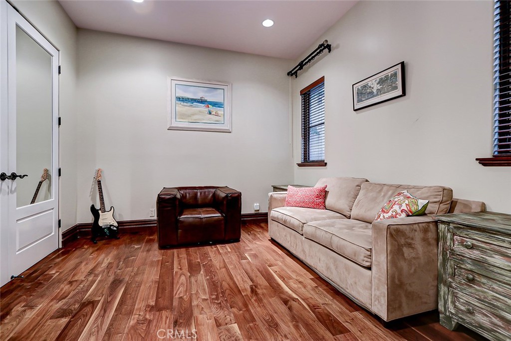 853 6th Street Manhattan Beach, CA 90266 - Photo 44 of 60 a living room with furniture and a wooden floor