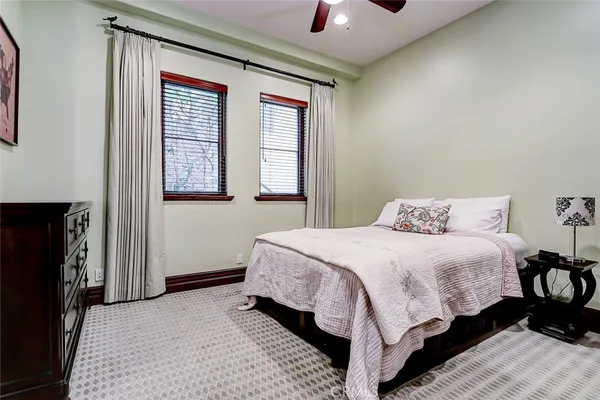 a living room with furniture a piano and a wooden floor