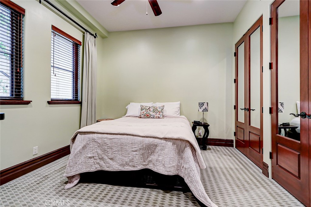 853 6th Street Manhattan Beach, CA 90266 - Photo 47 of 60 a bedroom with a bed lamp and a window