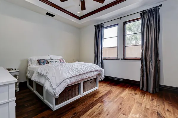 a living room with furniture or flat screen tv and kitchen view