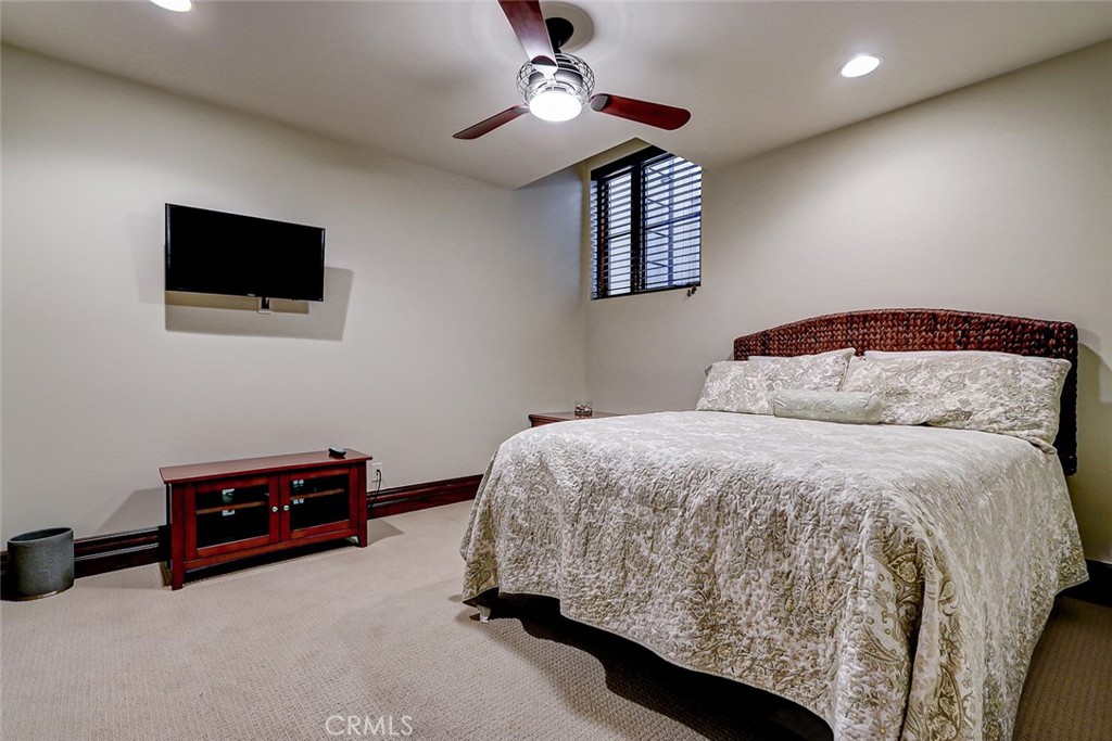 853 6th Street Manhattan Beach, CA 90266 - Photo 50 of 60 a bedroom with a bed and a chandelier