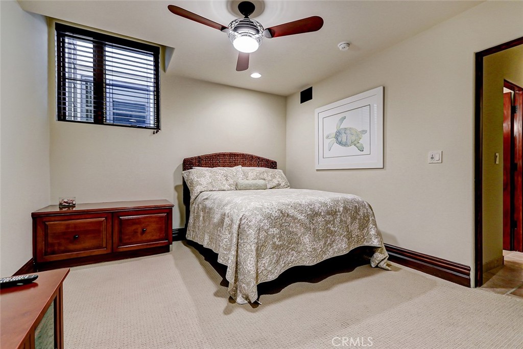 853 6th Street Manhattan Beach, CA 90266 - Photo 51 of 60 a bedroom with a bed and a chandelier