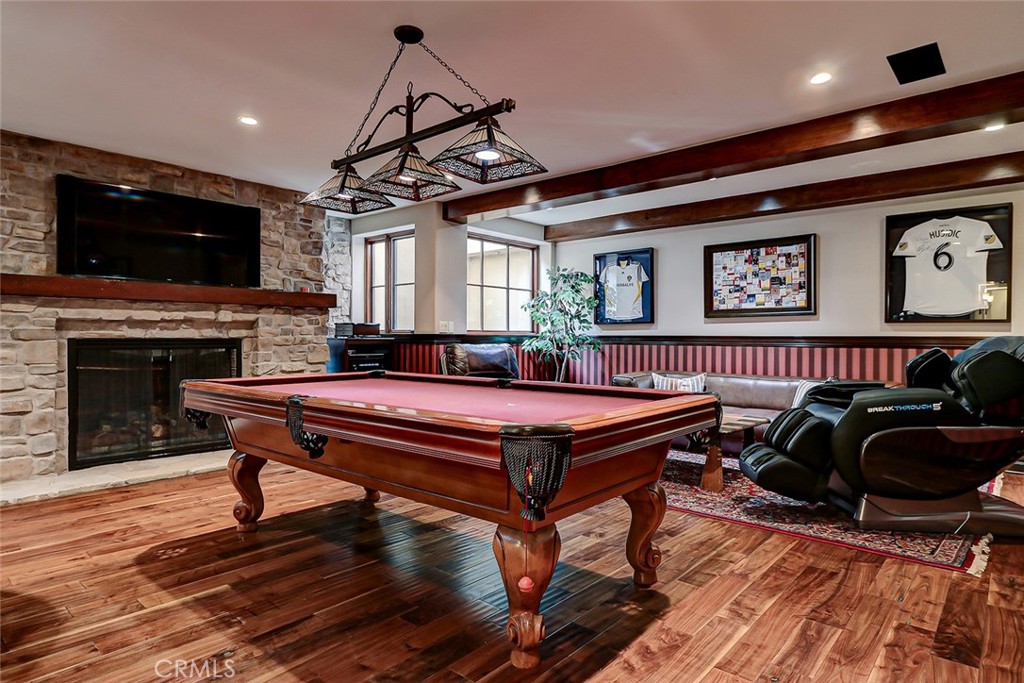 853 6th Street Manhattan Beach, CA 90266 - Photo 53 of 60 a living room with furniture a flat screen tv and a fireplace