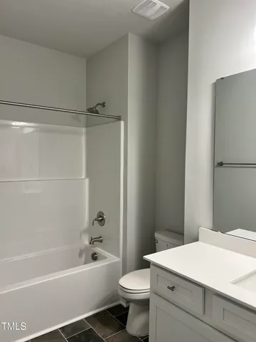 a bathroom with a sink double vanity and a mirror