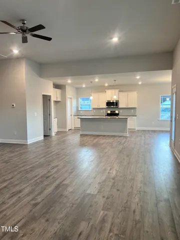 a view of a kitchen and a stove top oven