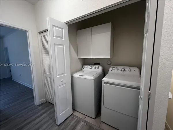 a utility room with dryer and washer