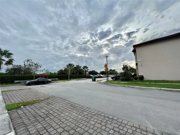 a view of a road with a yard