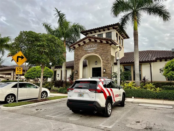 a front view of a house with parking space
