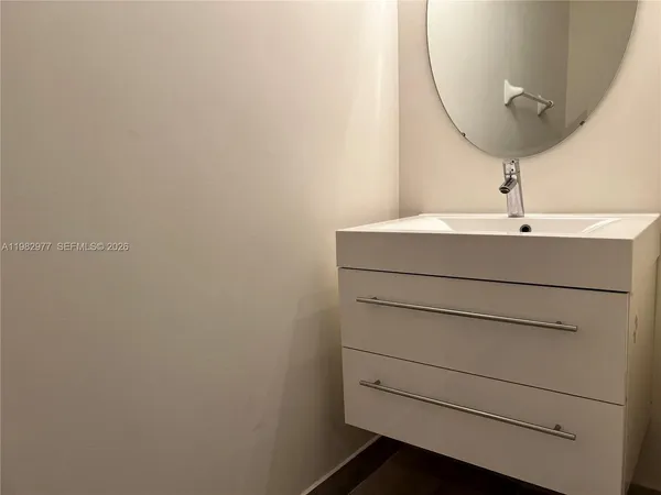 a bathroom with a sink and vanity
