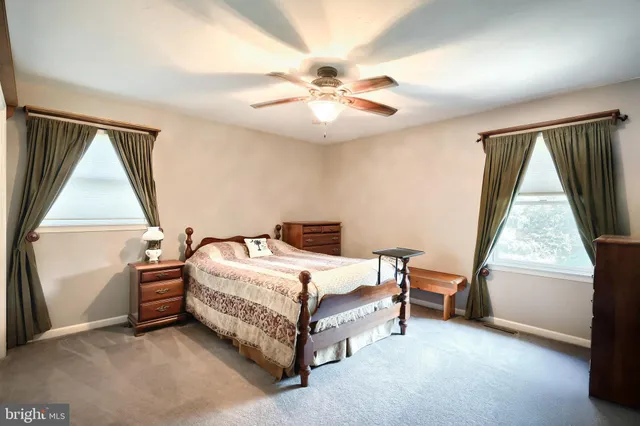 a bed room with a bed and a window