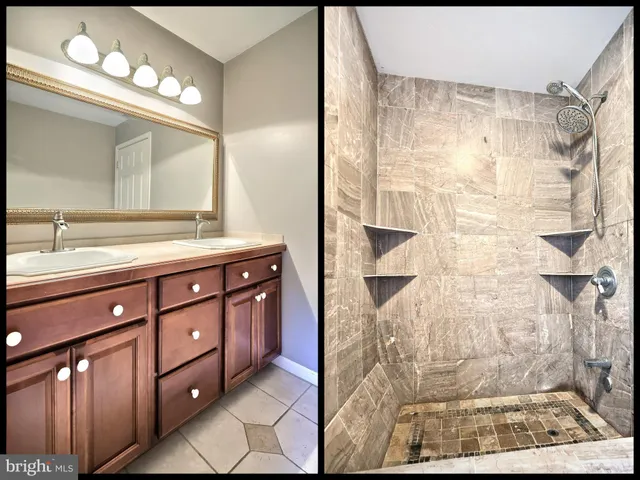 a bathroom with a sink vanity granite and a mirror