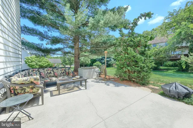 a view of a patio with a table and chairs