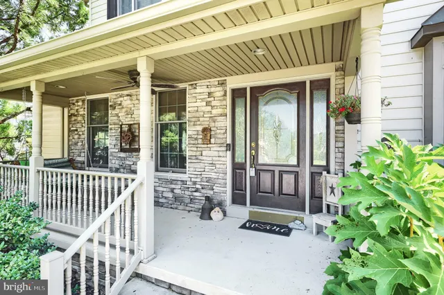 a view of a house with porch and wooden floor
