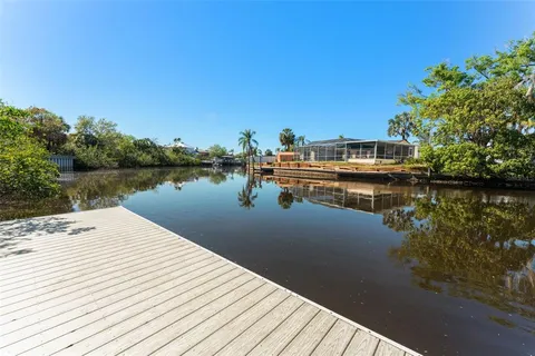 a view of a lake with wooden stairs and lake view
