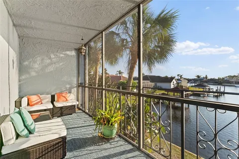a view of a balcony with furniture