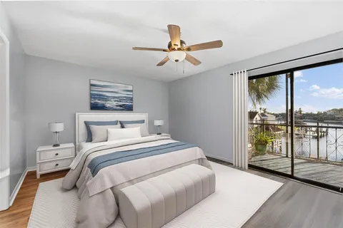 a bedroom with a large bed and a window