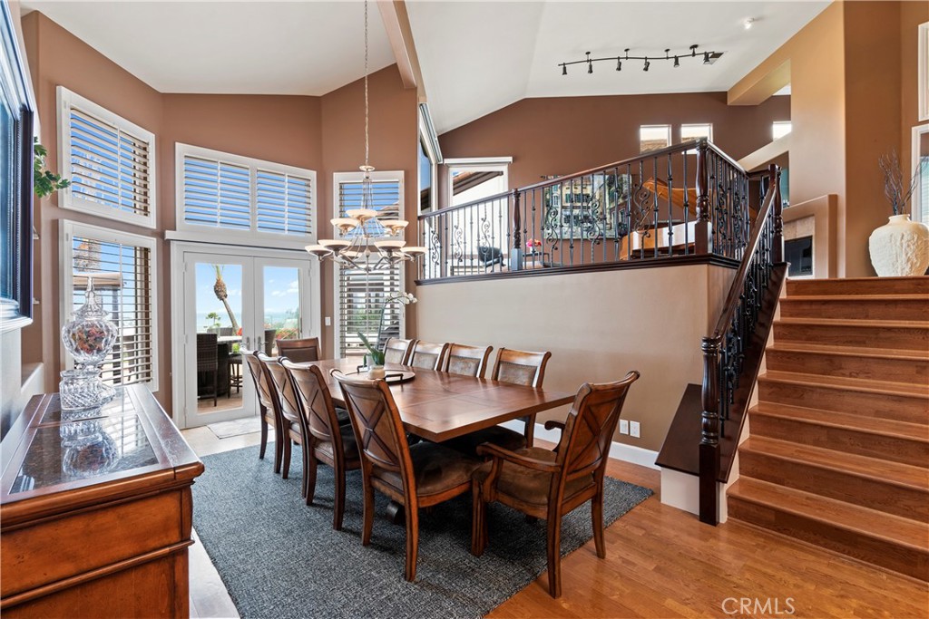 33662 Holtz Hill Drive Dana Point, CA 92629 - Photo 21 of 75 a view of a dining room with furniture and a chandelier