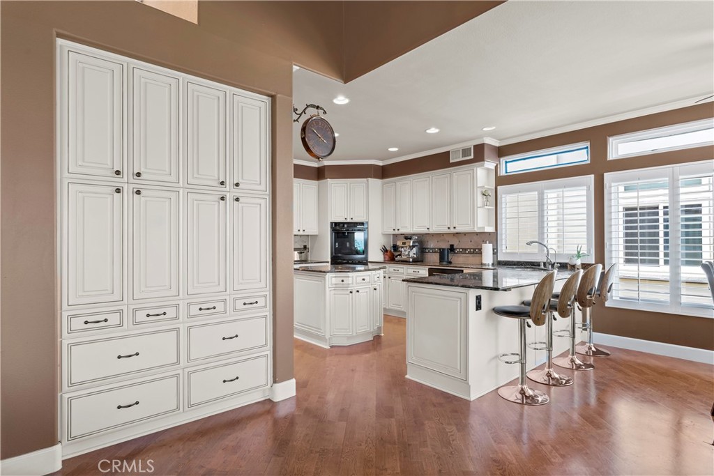 33662 Holtz Hill Drive Dana Point, CA 92629 - Photo 28 of 75 a kitchen with white cabinets and sink