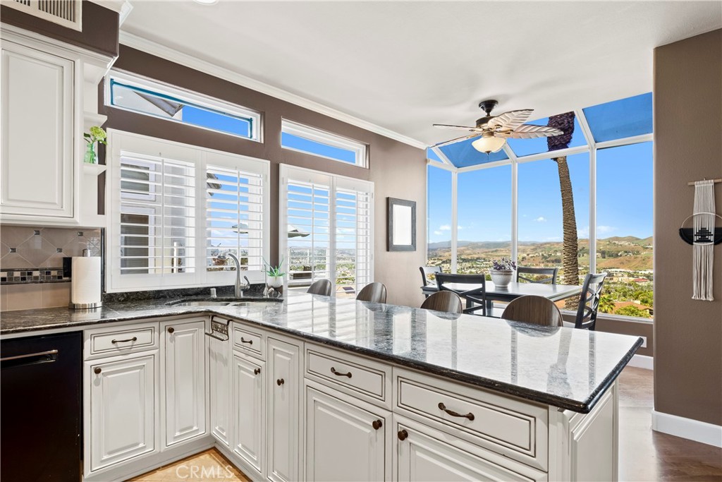 33662 Holtz Hill Drive Dana Point, CA 92629 - Photo 34 of 75 a very nice looking kitchen with granite countertop a sink and a window