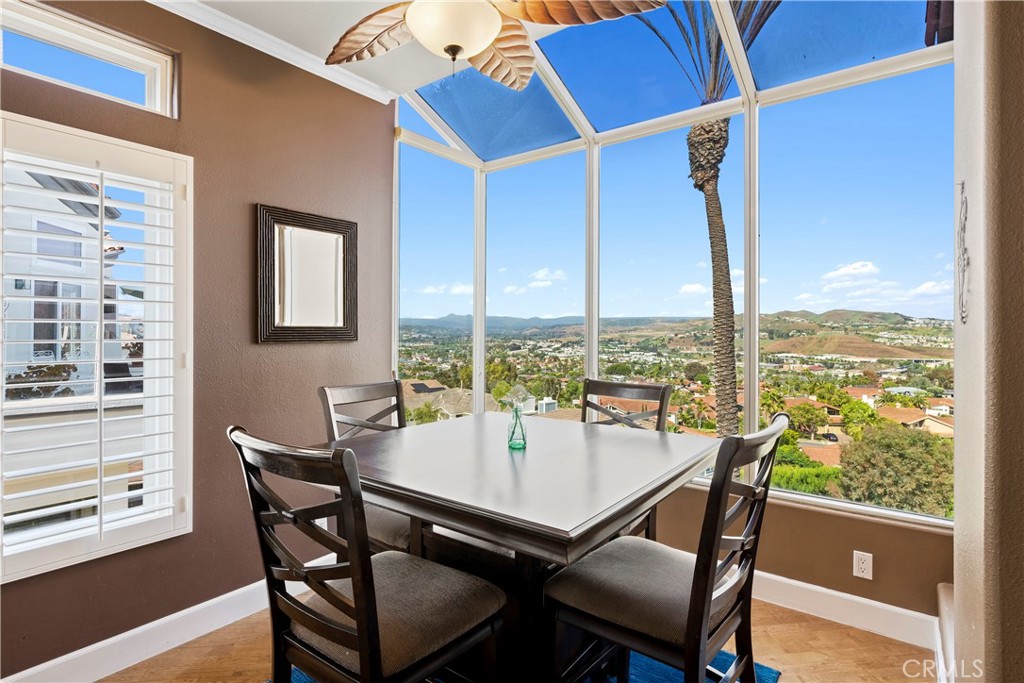 33662 Holtz Hill Drive Dana Point, CA 92629 - Photo 36 of 75 a view of a dining room with furniture window and wooden floor