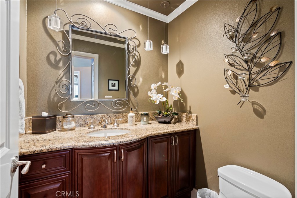33662 Holtz Hill Drive Dana Point, CA 92629 - Photo 40 of 75 a bathroom with a granite countertop sink and a mirror
