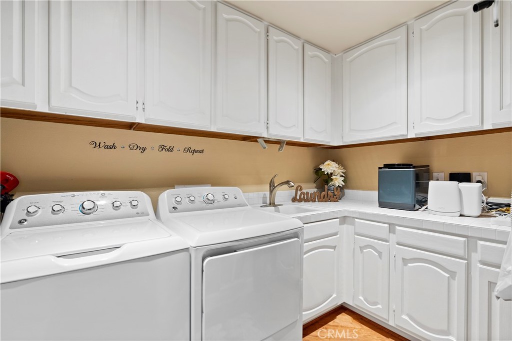33662 Holtz Hill Drive Dana Point, CA 92629 - Photo 41 of 75 a utility room with dryer and washer