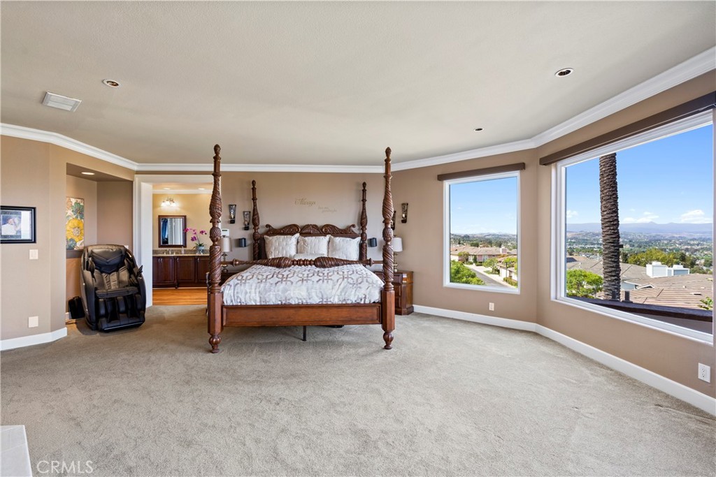 33662 Holtz Hill Drive Dana Point, CA 92629 - Photo 47 of 75 a bedroom with a bed and large window