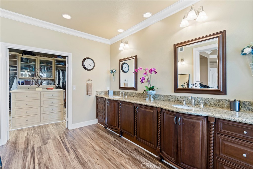 33662 Holtz Hill Drive Dana Point, CA 92629 - Photo 51 of 75 a bathroom with a double vanity sink and a mirror