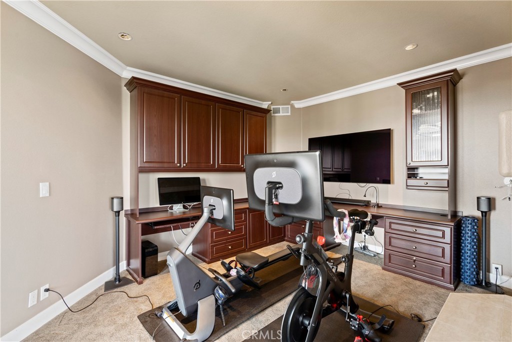 33662 Holtz Hill Drive Dana Point, CA 92629 - Photo 55 of 75 a living room with furniture a flat screen tv and kitchen view