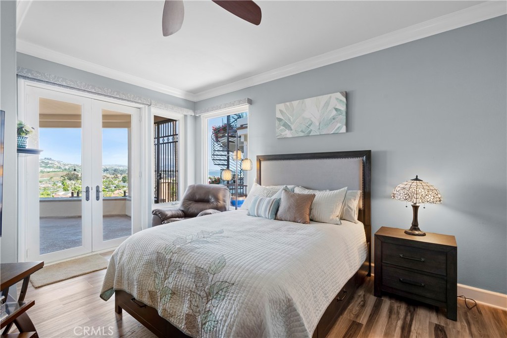 33662 Holtz Hill Drive Dana Point, CA 92629 - Photo 60 of 75 a bedroom with a bed and a lamp on dresser